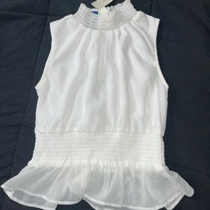 Sleeveless white blouse